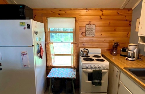 Rome Cabin | Charming lakefront cabin with large screened-in porch and lawn in Rome