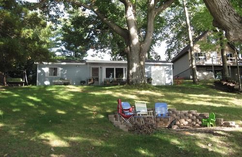 Evart Cottage | Charming Lakefront Cottage, Private Sandy Beach, Excellent Fishing