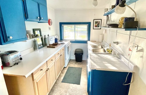 Polson Cabin | Charming rustic cabin with shared lake access and golf course views.