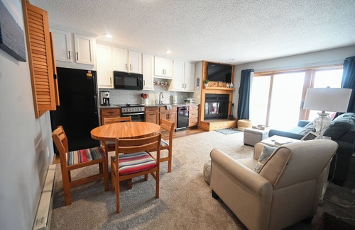 Bellaire Condo | Charming sleeps 6, 2 bath steps to golf, Enjoy fall colors on your deck!