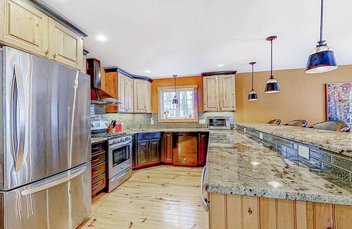 Alton Bay House | Charming & sun-filled nature escape with large deck, wood stove, fire pit, & W/D