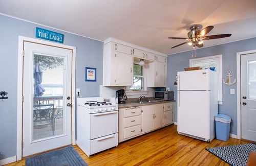 Sturgeon Bay Cottage | Charming Waterfront Cabin on Clark Lake- paddleboat and canoes!