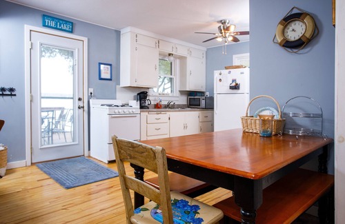 Sturgeon Bay Cottage | Charming Waterfront Cabin on Clark Lake- paddleboat and canoes!