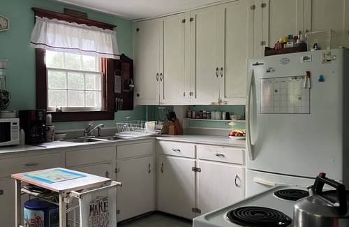 Pawcatuck House | Charming waterfront 1920s Craftsman-style home on 4+ private acres