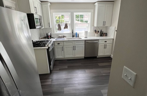 Framingham House | Cheerful entire house with 3 bedrooms and work area.