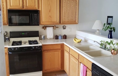 Westside House | Cheerful NM style home with indoor fireplace