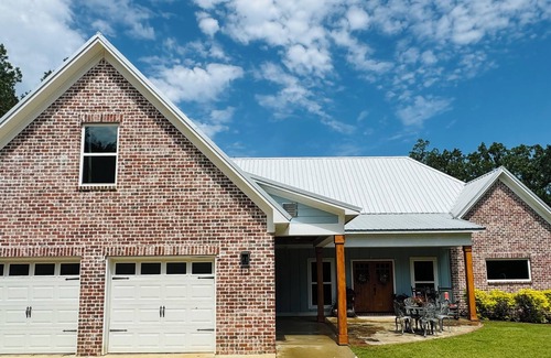 Water Valley House | Chef designed kitchen, 3 living spaces, surrounded by woods for privacy!