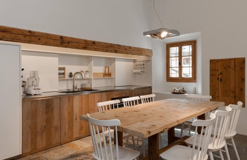 La Punt-Chamues-ch Apartment | Ches'Ota: Historic Engadine House with Garden and Modern Flair