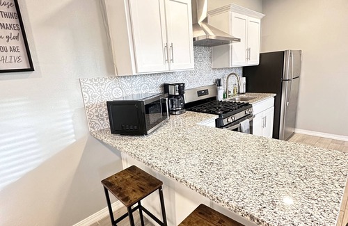 Pershing - Government Hill House | Chic Tiny Brick Home: Remodeled Unit 1n