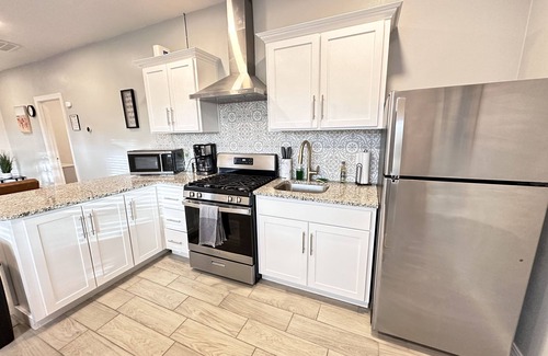 Pershing - Government Hill House | Chic Tiny Brick Home: Remodeled Unit 1n