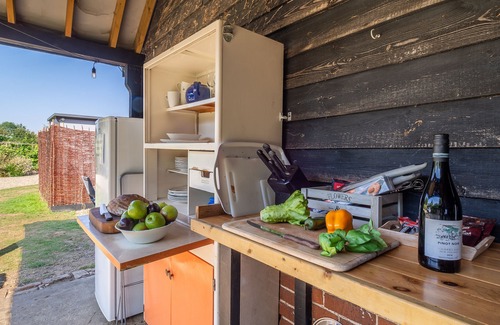 Brandeston Apartment | Clarabelle is a beautiful shepherd's hut set in a blooming kitchen garden