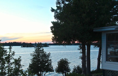Alexandria Bay Cottage | Classic Summer Cottage with Spectacular Wrap-Around River View