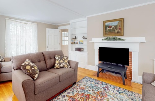 Orono House | Classic waterfront retreat with a grill, firepit, four bedrooms, W/D, and AC