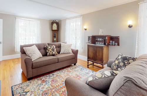 Orono House | Classic waterfront retreat with a grill, firepit, four bedrooms, W/D, and AC