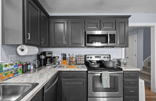 Spring Hill House | Clean, spacious, and fully renovated townhouse with modern charm and comfort.