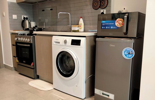 Al Khan Apartment | Coastal Elegance: Studio, Pool & Beach Proximity