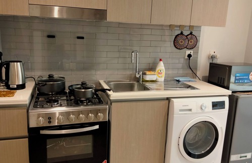 Al Khan Apartment | Coastal Elegance: Studio, Pool & Beach Proximity