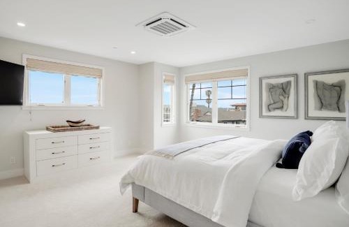 Beach Barber Tract House | Coastal retreat near the beach w Panoramic Ocean Views, Rooftop Deck, & Firepit