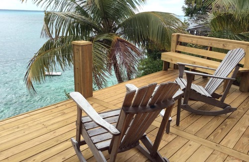 Green Turtle Cay Cottage | Coco Nut Tree House is nestled in Tropical Foliage on Crystal Clear Sea of Abaco