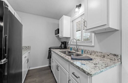 Indian Point Condo | Come stay at this modern 2 bedroom suite, located close to Table Rock Lake and Silver Dollar City.