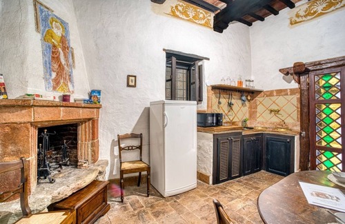 Magione Apartment | Comfortable apartment located in a historic Abbey from the year 1000, restored in 1980.La Badia is a small Benedictine Abbey immersed in a park of centuries-old olive trees.Located on the ground floor, there is a mezzanine for the sleeping area.There are