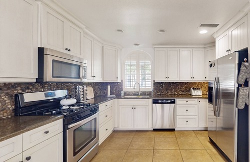Bass Lake House | Community pool/hot tub, lake views, gas grill, fully equipped kitchen, streaming
