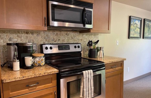 Copperstone Resort Condo | Copper Point - Outdoor Hot Tub | Fire Table | Gym