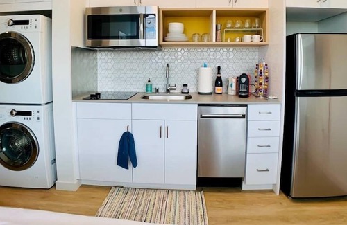 Roosevelt Condo | Corner unit studio with natural light and premium amenities for a very comfortable quick stay.