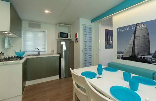 Sirmione House | Cosy apartment in villa for 5 guests with A/C, pool, WIFI, TV, patio and pets allowed