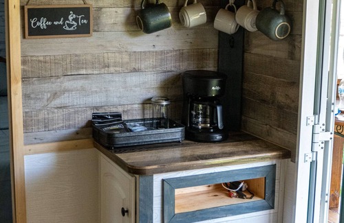 Canvas House | Cotch under a sugar maple tree w/firepit, swing and outdoor shower