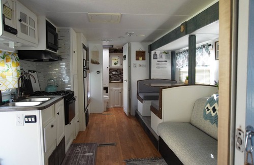 Canvas House | Cotch under a sugar maple tree w/firepit, swing and outdoor shower