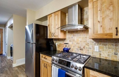 Glacier House | County Home with a Hot Tub and Modern Kitchen