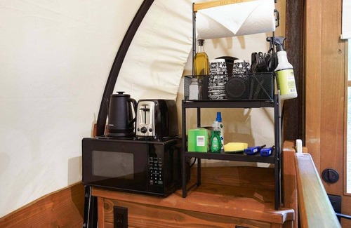 Strasburg RV Rental | Covered Wagon Camping along Creek, Sleeps 4