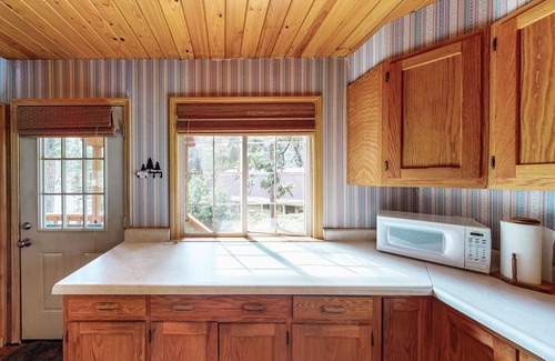Arnold House | Cozy cabin with large deck, grill, fast WiFi, central AC, & wood-burning stove