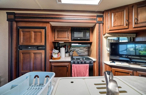 North Topsail Beach House | Cozy camper with outside kitchen & grill, pool and walking distance to the beach