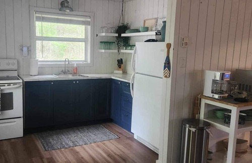 Cambridge-Narrows Cottage | Cozy Cottage One row off the lake with lake access.