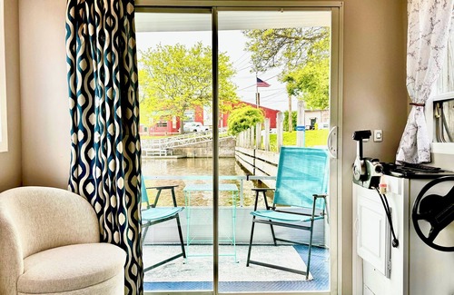 Medina Boat Rental | Cozy Erie Canal Houseboat in the Heart of Bustling Downtown Medina