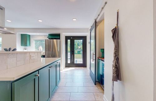 Crystal House | Cozy fenced in home with central AC, Fire table, WiFi, and large deck