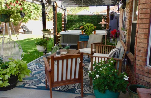 Parkway House | cozy getaway with hot tub, sits on a relaxing patio, close freeway access
