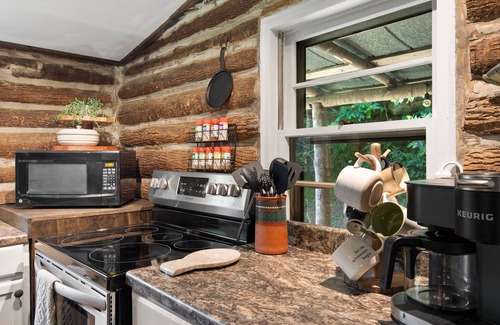 Spruce Pine Cabin | Cozy Hand Built Log Cabin Rocking Chair Porch King Bed