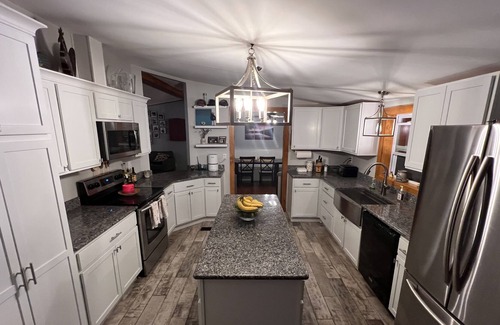 Barnstead House | Cozy home with private beach on Huntress Pond and short drive to skiing!
