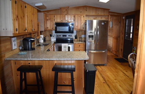 Lowesville House | Cozy log cabin, centrally located with covered storage for an RV/Boat