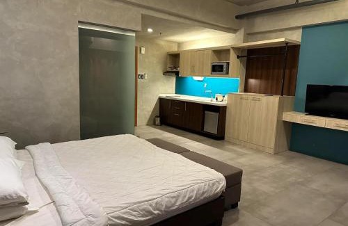 Kaunlaran Apartment | Cozy Spacious Pet Friendly Unit with Netflix Pool Gym