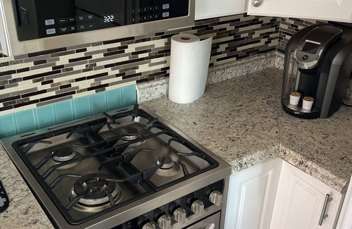 Sunset Beach Apartment | Cozy Sunset Beach Studio with Peek A Boo Ocean Views (Second Story/Dog Friendly)