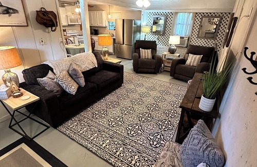 Fairhope Cottage | Cozy waterfront camp with dock and boat slip. Multiple outdoor spaces to enjoy!