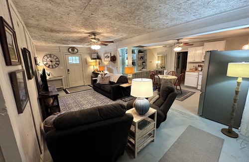 Fairhope Cottage | Cozy waterfront camp with dock and boat slip. Multiple outdoor spaces to enjoy!