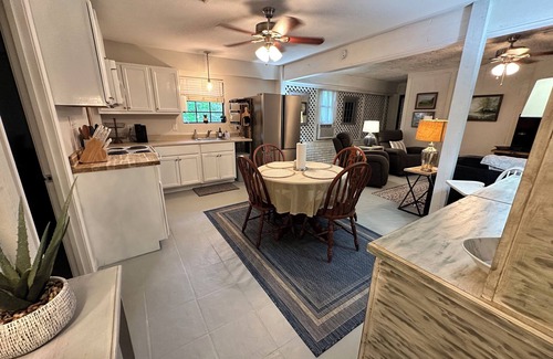 Fairhope Cottage | Cozy waterfront camp with dock and boat slip. Multiple outdoor spaces to enjoy!