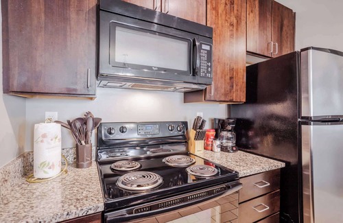 Central Business District Apartment | CozySuites at the Banks gym, pool 07