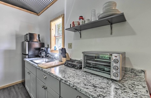 East Tallassee Cabin | Creekside Cabin Retreat w/Community Fire Pit