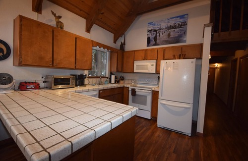 Dorrington Cabin | Dave's Den large game room loft, enjoy the large trees, swimming pool, adventure